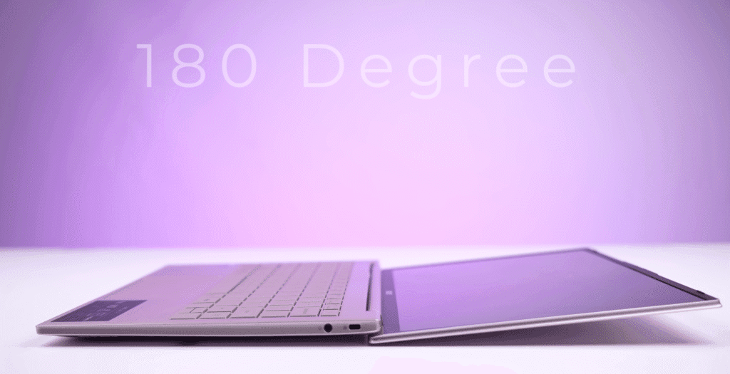 An Acer laptop opened flat at a 180-degree angle on a white surface with a purple background.