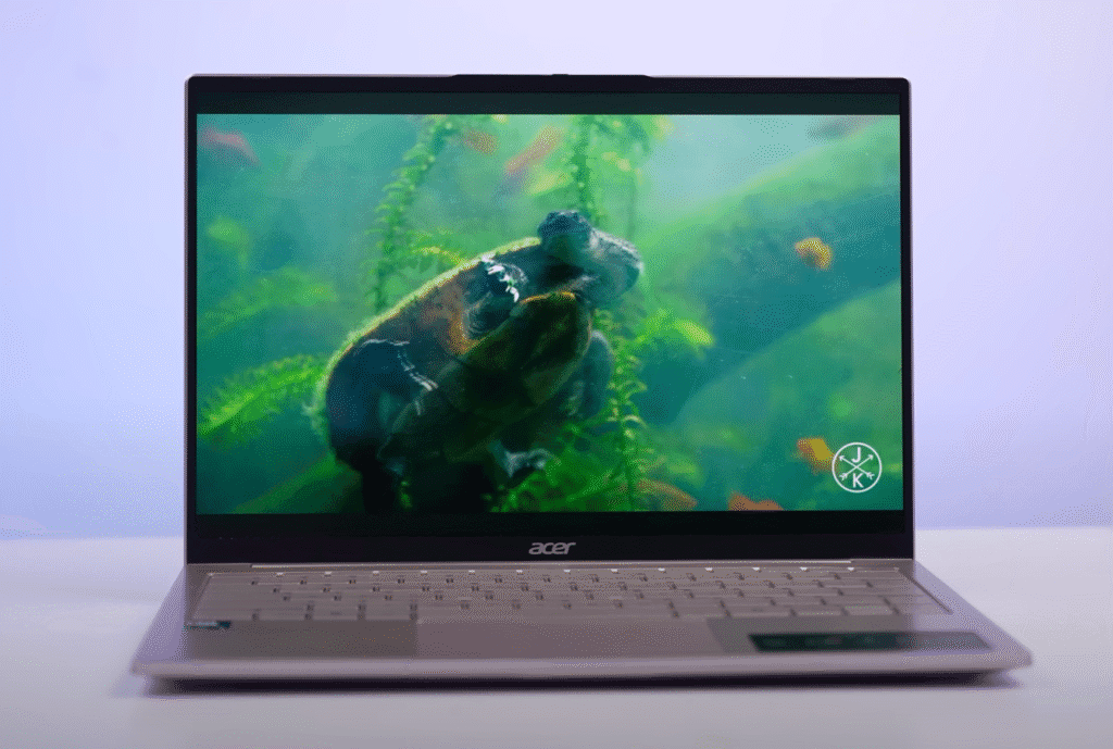 Acer laptop showcasing a vibrant OLED display playing an underwater video of a turtle, highlighting its colour accuracy and contrast.