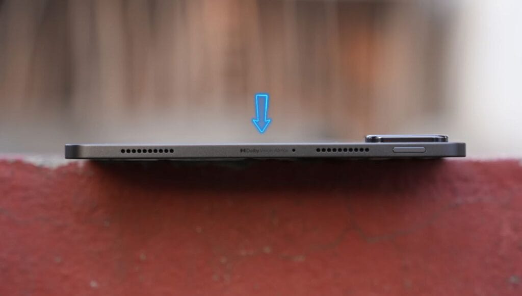 Alternate side view of the Xiaomi Pad 7, focusing on the buttons and speaker grill details